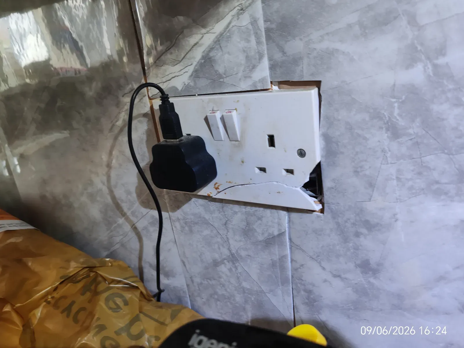 Damaged kitchen socket outlet found during an electrical safety inspection