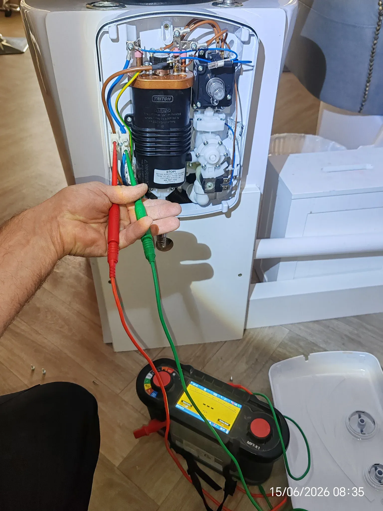 Electric shower circuit being tested during an electrical installation condition report