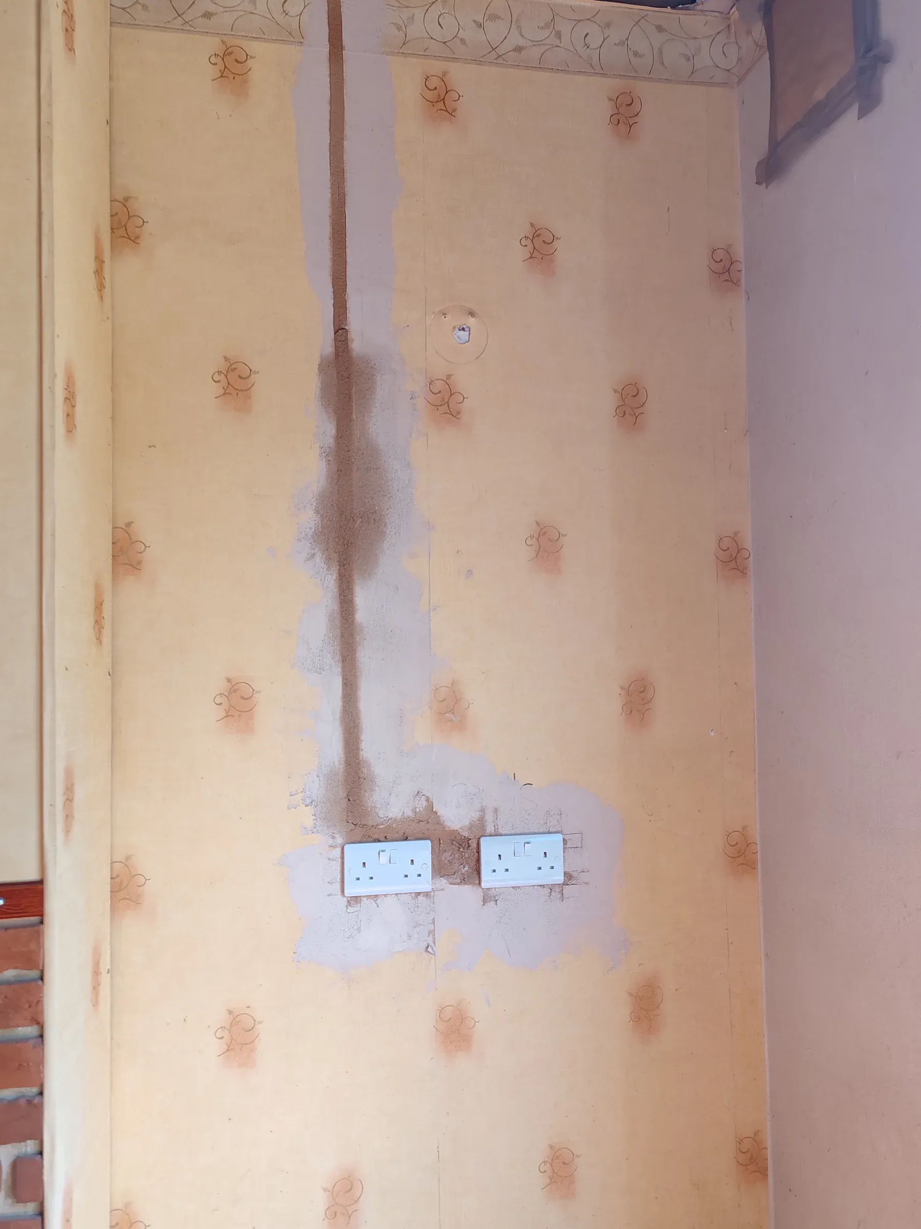 New double socket outlets installed with wall chasing visible during a house rewire